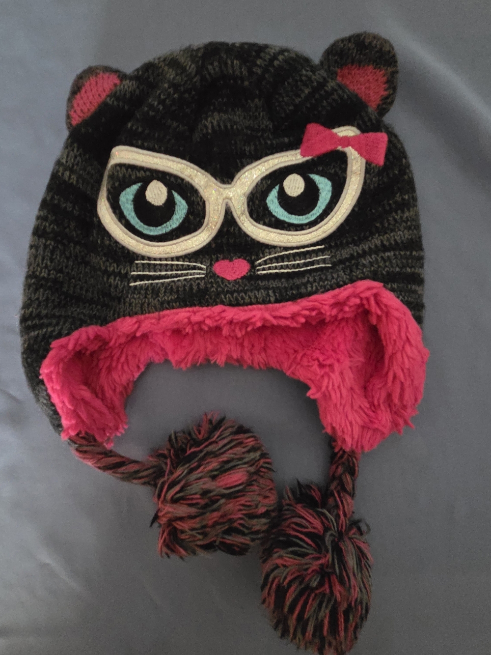 Capelli of New Yo Kids Black Knit Cat Ear Hat with Hot Pink Lining and Blue Eyes